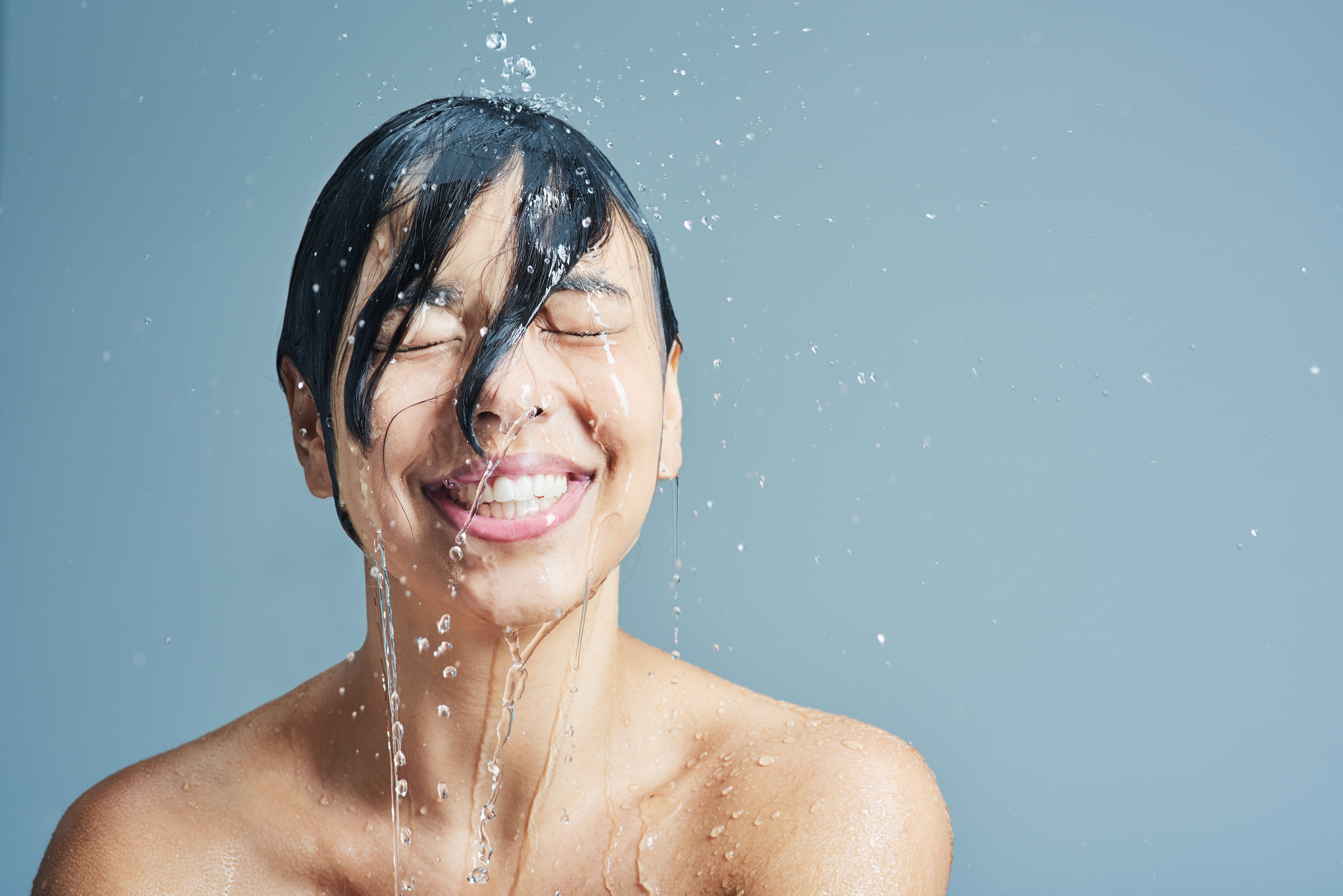 Woman enjoying a hot shower